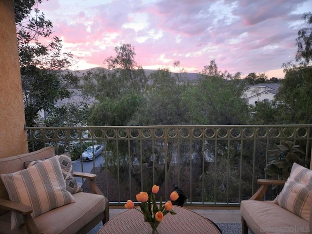 view of balcony at dusk