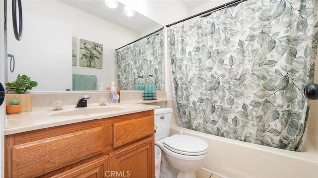 full bathroom featuring vanity, shower / tub combo, and toilet