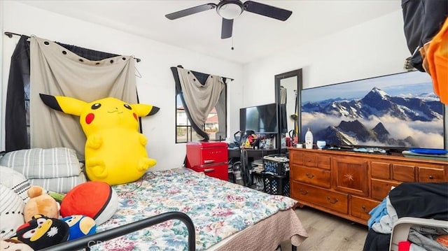 bedroom featuring ceiling fan and light hardwood / wood-style floors