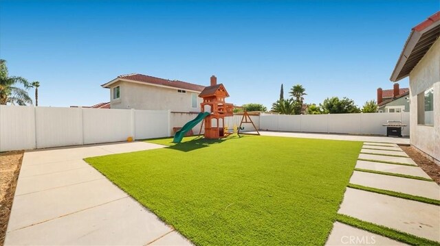 view of yard with a playground