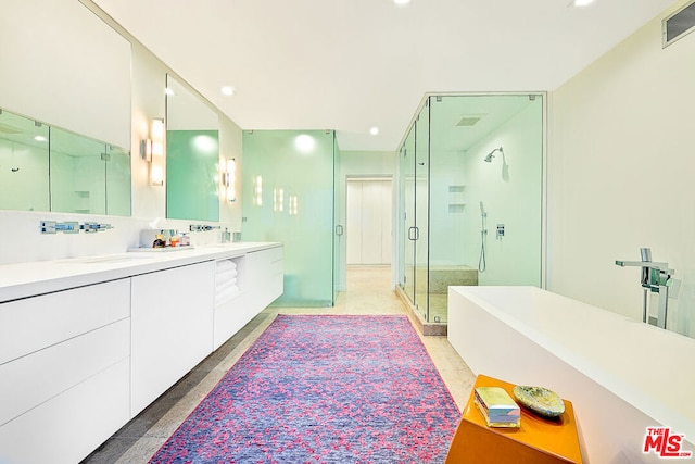 bathroom featuring vanity and a shower with door