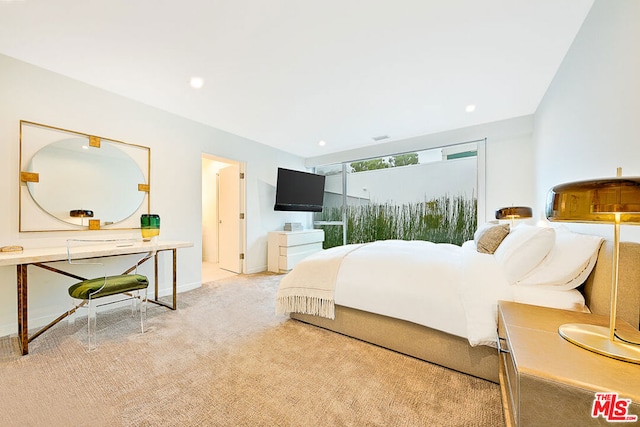 bedroom featuring light colored carpet