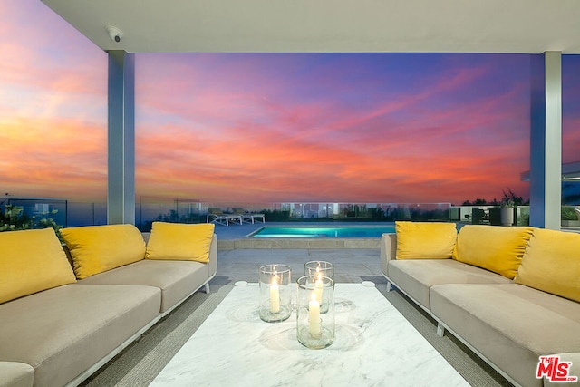 view of patio terrace at dusk