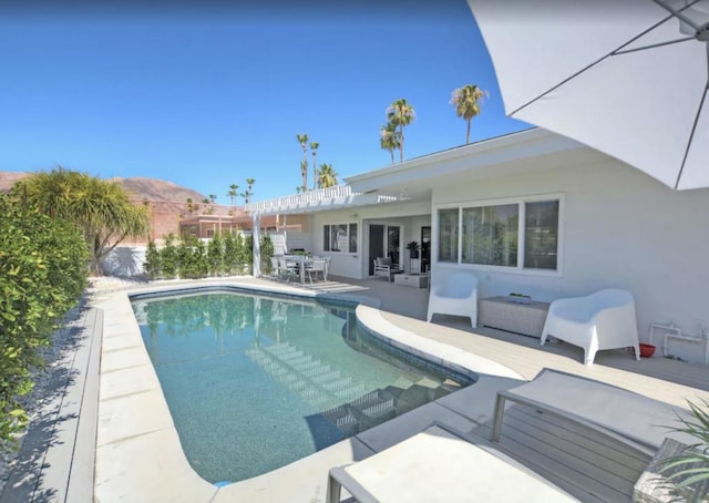 view of pool with an outdoor living space and a patio