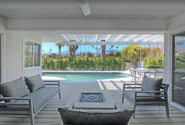 view of pool featuring outdoor lounge area and ceiling fan