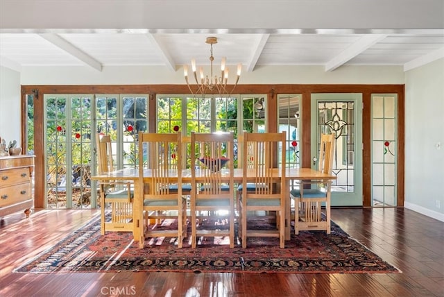 unfurnished dining area with a notable chandelier, a healthy amount of sunlight, beamed ceiling, and hardwood / wood-style floors