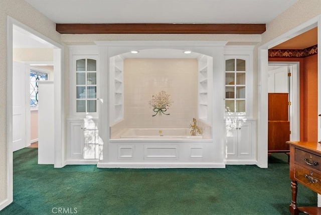 interior space with beamed ceiling and dark colored carpet