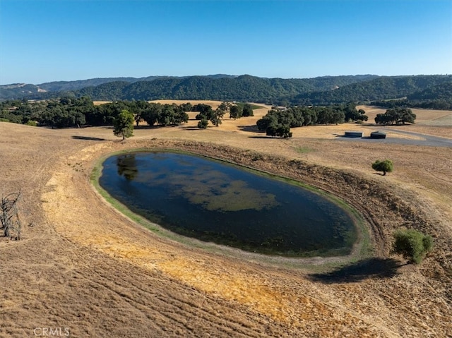 bird's eye view featuring a rural view and a water and mountain view