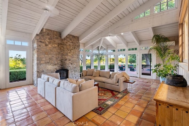 sunroom / solarium featuring french doors, vaulted ceiling with beams, and plenty of natural light