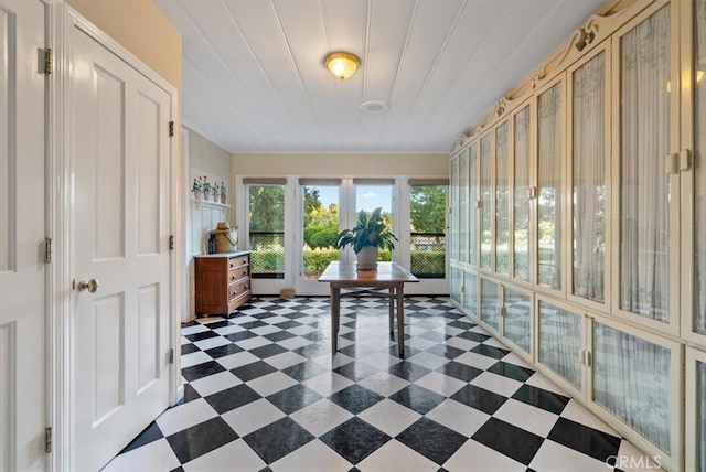 unfurnished sunroom featuring french doors