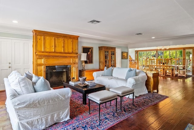 living room featuring ornamental molding and hardwood / wood-style floors