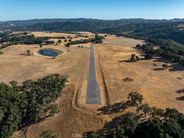 birds eye view of property with a mountain view