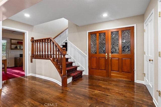 foyer entrance featuring dark hardwood / wood-style floors