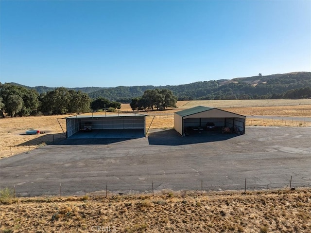 exterior space featuring a rural view and a mountain view