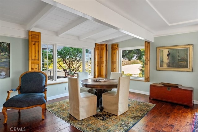 dining room featuring lofted ceiling with beams and dark wood-type flooring