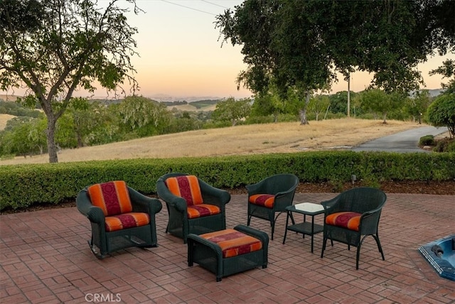 view of patio terrace at dusk