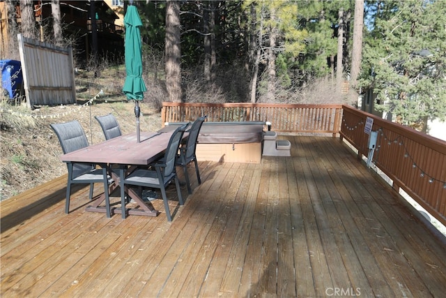 deck featuring a hot tub