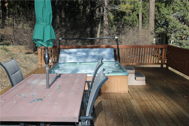 wooden terrace featuring a hot tub