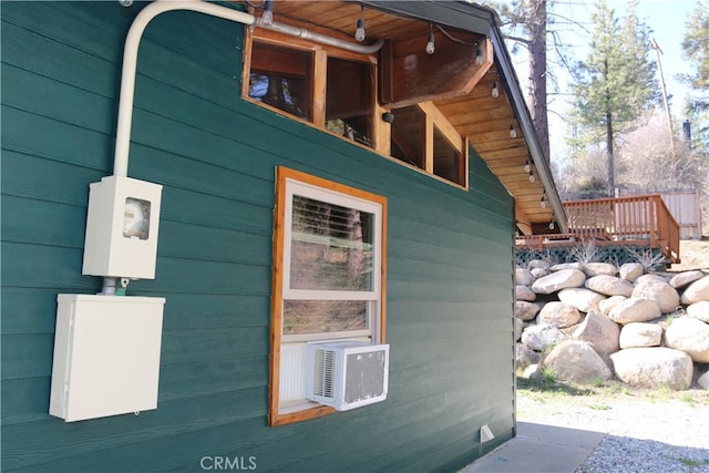 view of side of home with a wooden deck