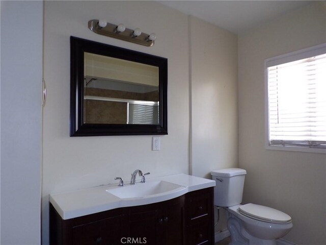 4066 Tenango Rd, Claremont, CA 91711 - full bathroom featuring toilet, a shower with shower door, and vanity
