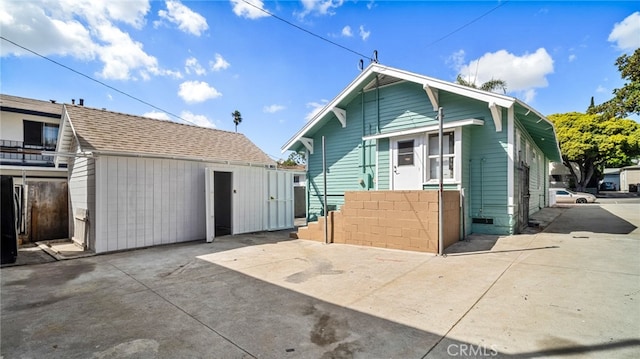 rear view of property featuring a patio area