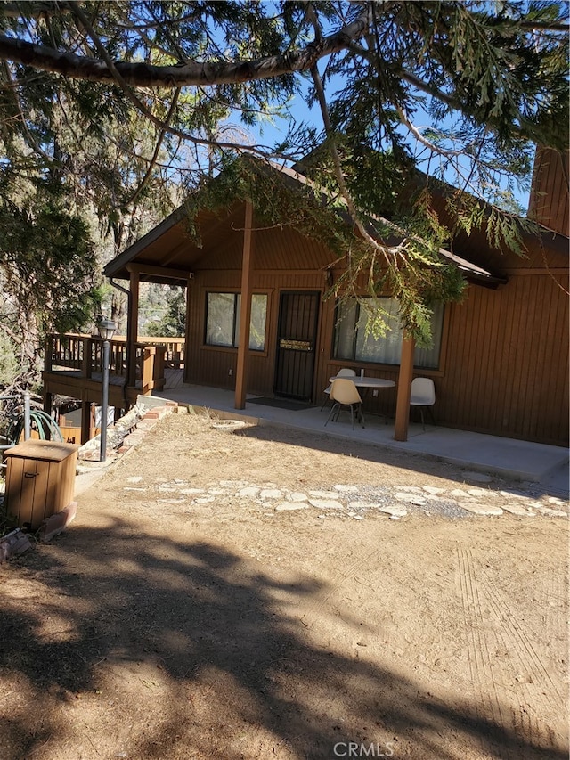 exterior space with a deck and a patio area