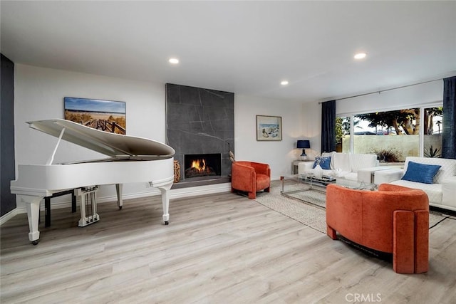 16592 Grimaud Ln, Huntington Beach, CA 92649 - living area featuring wood finished floors, a tile fireplace, recessed lighting, and baseboards