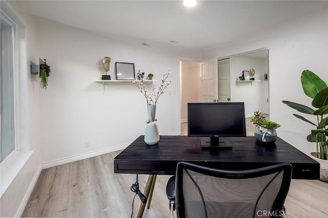 office with light hardwood / wood-style floors