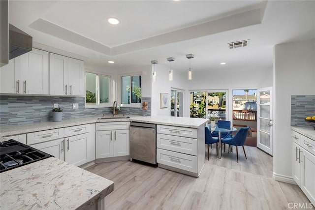 16592 Grimaud Ln, Huntington Beach, CA 92649 - kitchen with dishwasher, a peninsula, backsplash, a raised ceiling, and recessed lighting