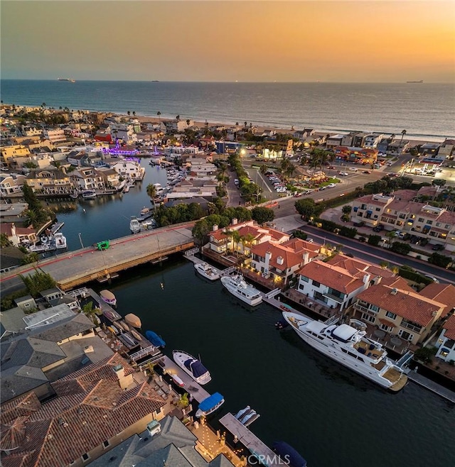 aerial view at dusk with a water view