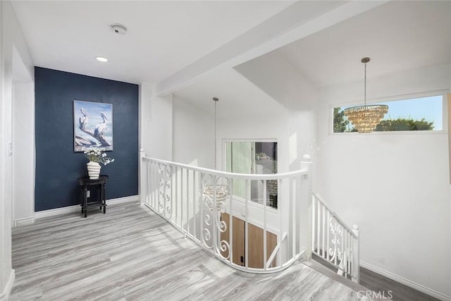 16592 Grimaud Ln, Huntington Beach, CA 92649 - corridor with an upstairs landing, a chandelier, wood finished floors, baseboards, and recessed lighting