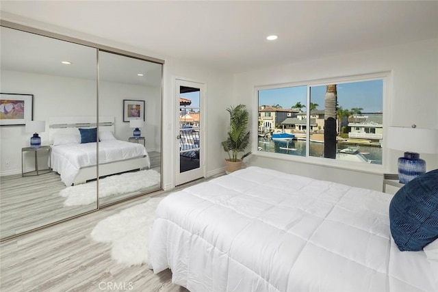 bedroom featuring a closet and hardwood / wood-style flooring