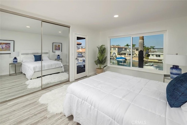 16592 Grimaud Ln, Huntington Beach, CA 92649 - bedroom featuring recessed lighting, access to outside, wood finished floors, baseboards, and a closet