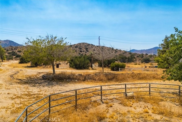 view of yard featuring a mountain view and a rural view