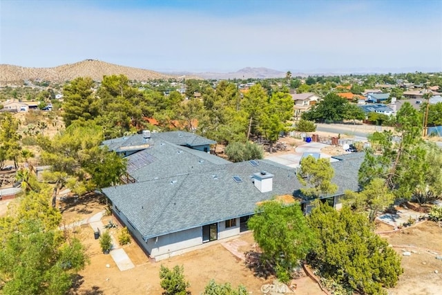 birds eye view of property featuring a mountain view