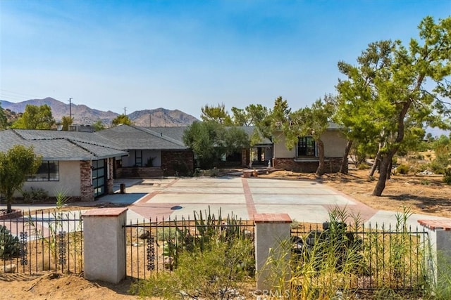 back of house with a mountain view