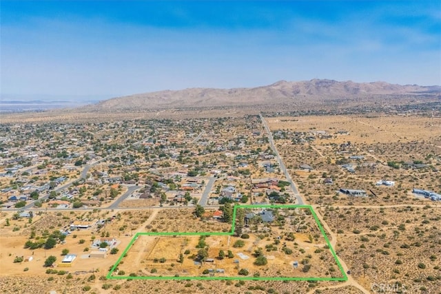 drone / aerial view featuring a mountain view