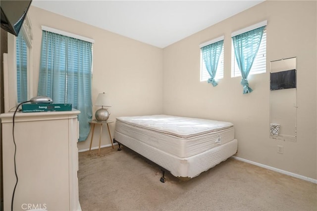 bedroom with carpet and baseboards