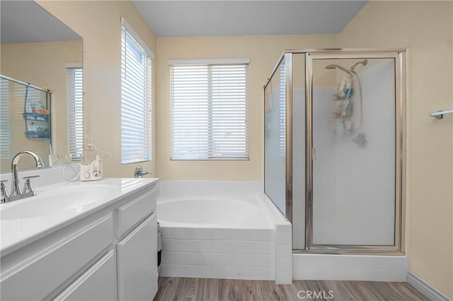 full bathroom with a garden tub, wood finished floors, and a stall shower