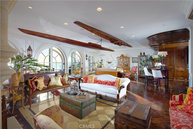 living room featuring crown molding, parquet floors, and vaulted ceiling