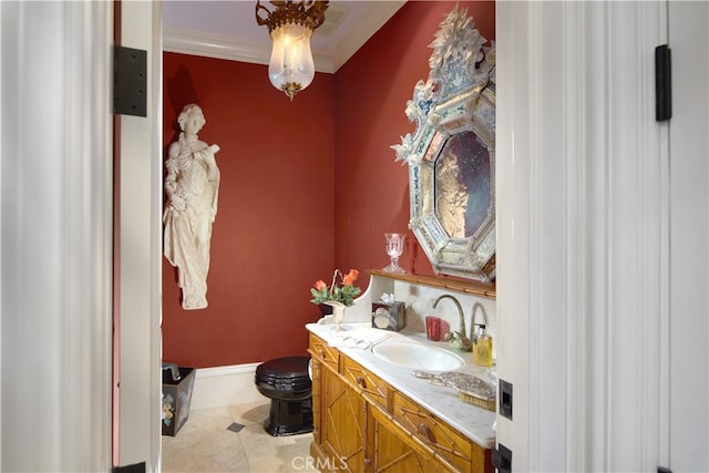 bathroom with vanity, toilet, crown molding, and tile patterned flooring