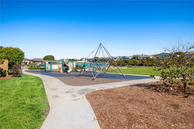 view of jungle gym featuring a lawn