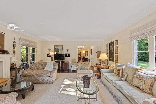 living room with light colored carpet, crown molding, and an inviting chandelier