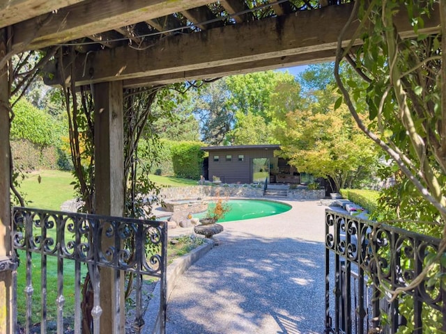 view of patio with an outbuilding