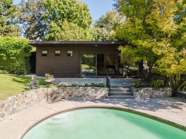 view of swimming pool with a patio area