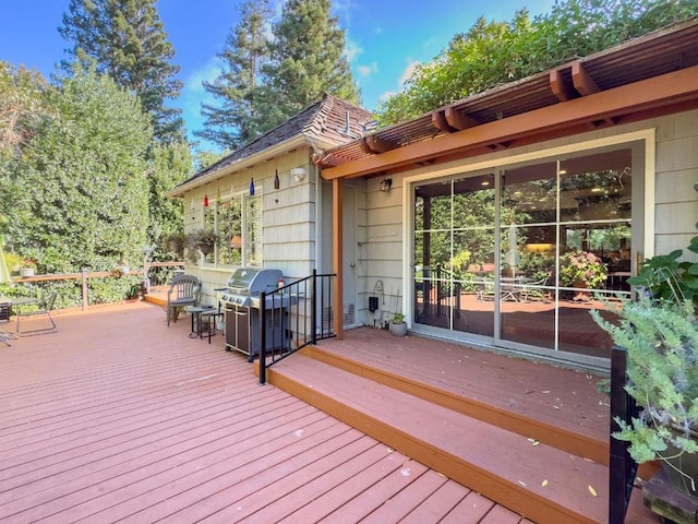 wooden terrace with a grill