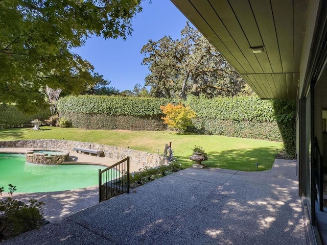 view of patio featuring a pool with hot tub