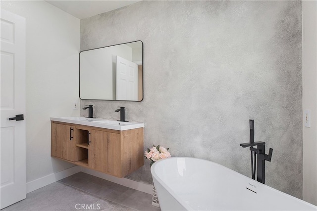 bathroom with vanity, concrete flooring, and a washtub