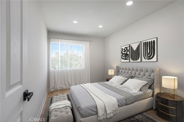 bedroom with hardwood / wood-style flooring