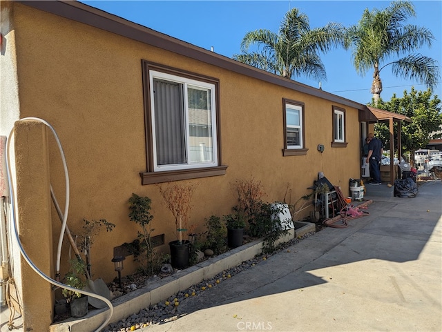 view of property exterior featuring a patio area